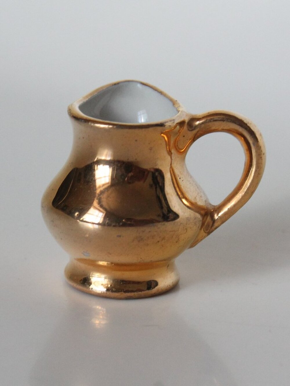 Miniature Golden Pitcher with Perpendicular Handle